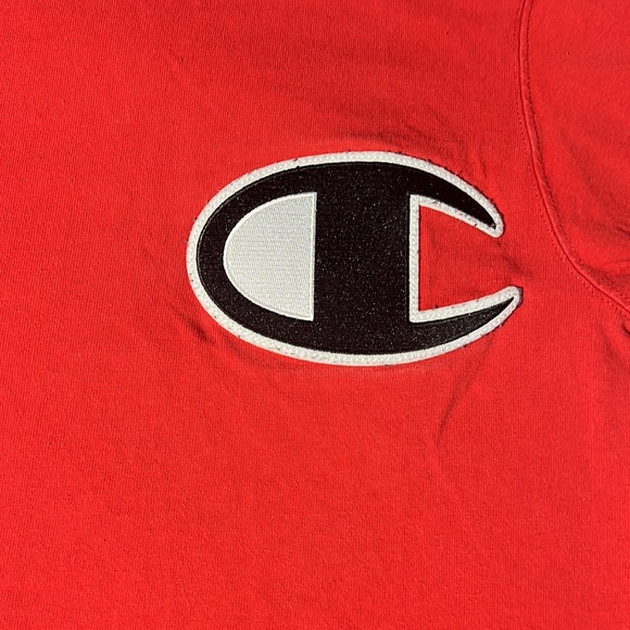 This is a champion shirt. True to its size, it’s a small. The color is red. - Picture 2 of 4